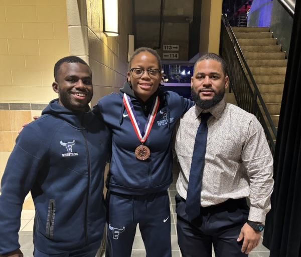 Summer Rodgers was seen elated with wrestling coaches Deandre Neroes and Michael Heggie. 
